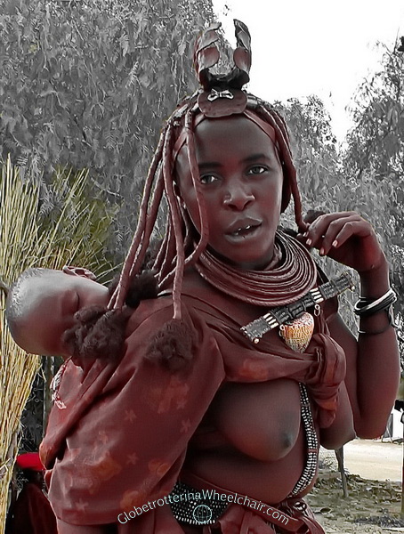 The Himba people in wonderful Namibia - Married women wears the large “ohumba” shell and a small crown made (“erembe” leather headdress) of goat skin on their heads. Namibia